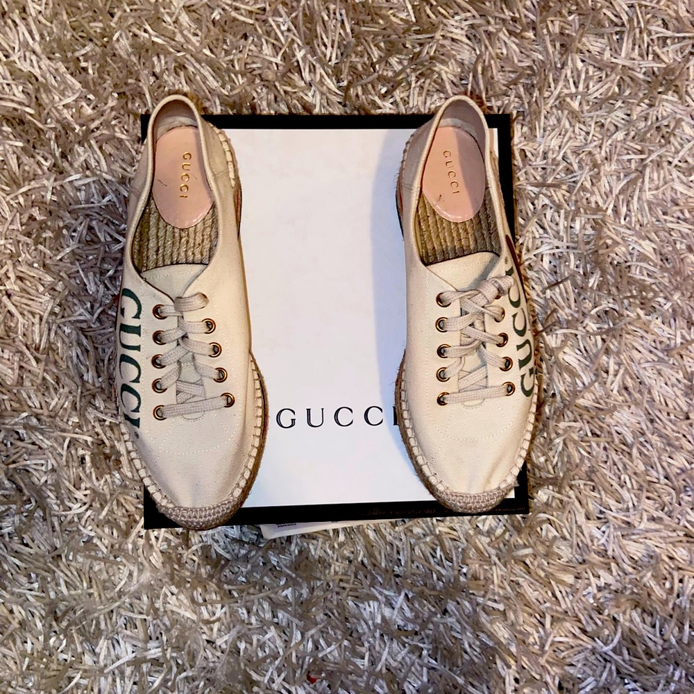 Gucci Size 8 platform sneaker with straw detail.